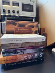 My anti library of time, 7 books on time piled up on my desk